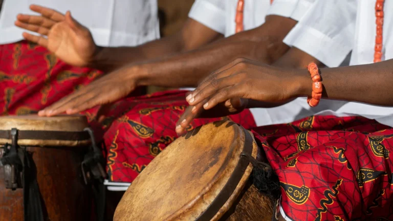 Sound Therapy and African Drumming for Mental Clarity Close up hands playing African drums