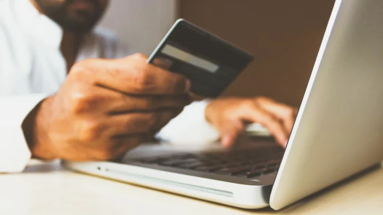 Is Online Banking Secure? 7 Tips to Protect Your Money Stock photo of the Business Man with a credit card by rupixen - online banking