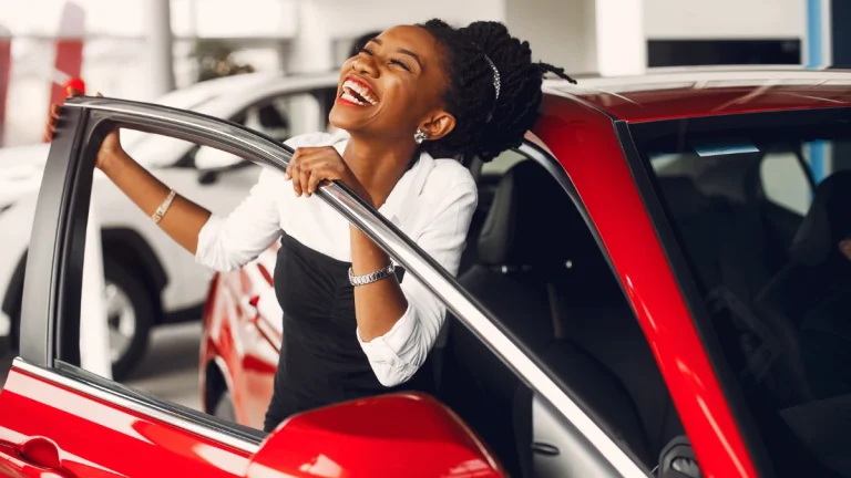 Buying a Car in 2025? Here’s What to Expect on Prices Stylish black woman in a car salon (1)