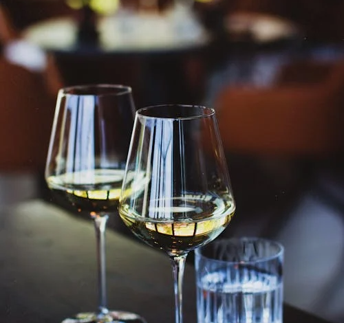 Close Up Photo of Glasses of Wine - Pexels Kristina Paukshtite